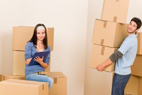 Manual handling and careful item movement in storage area